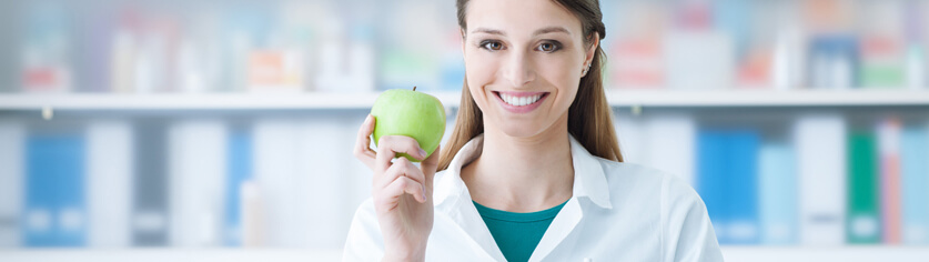a woman holding an apple
